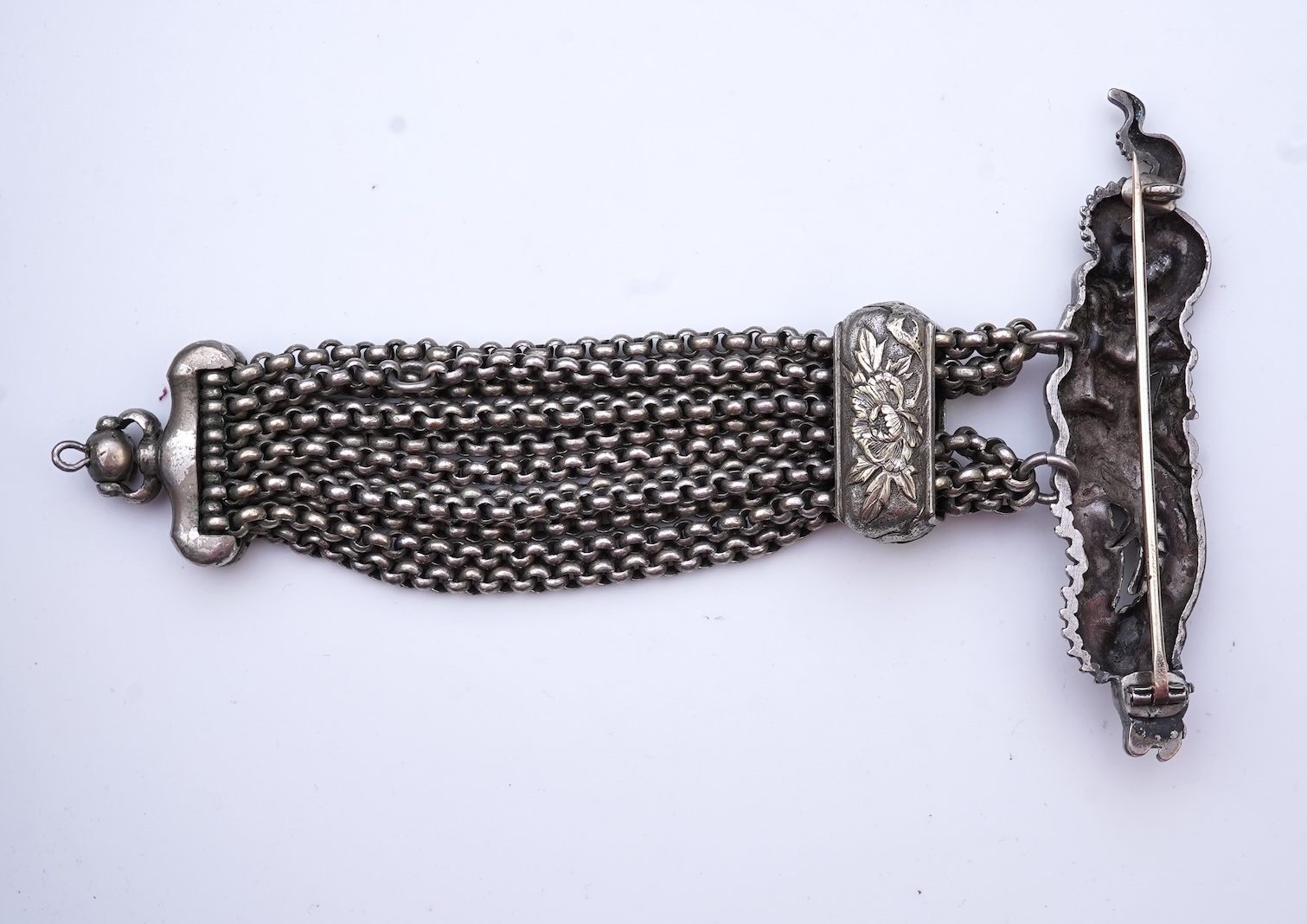 A chatelaine and a pair of serpentine bead earrings